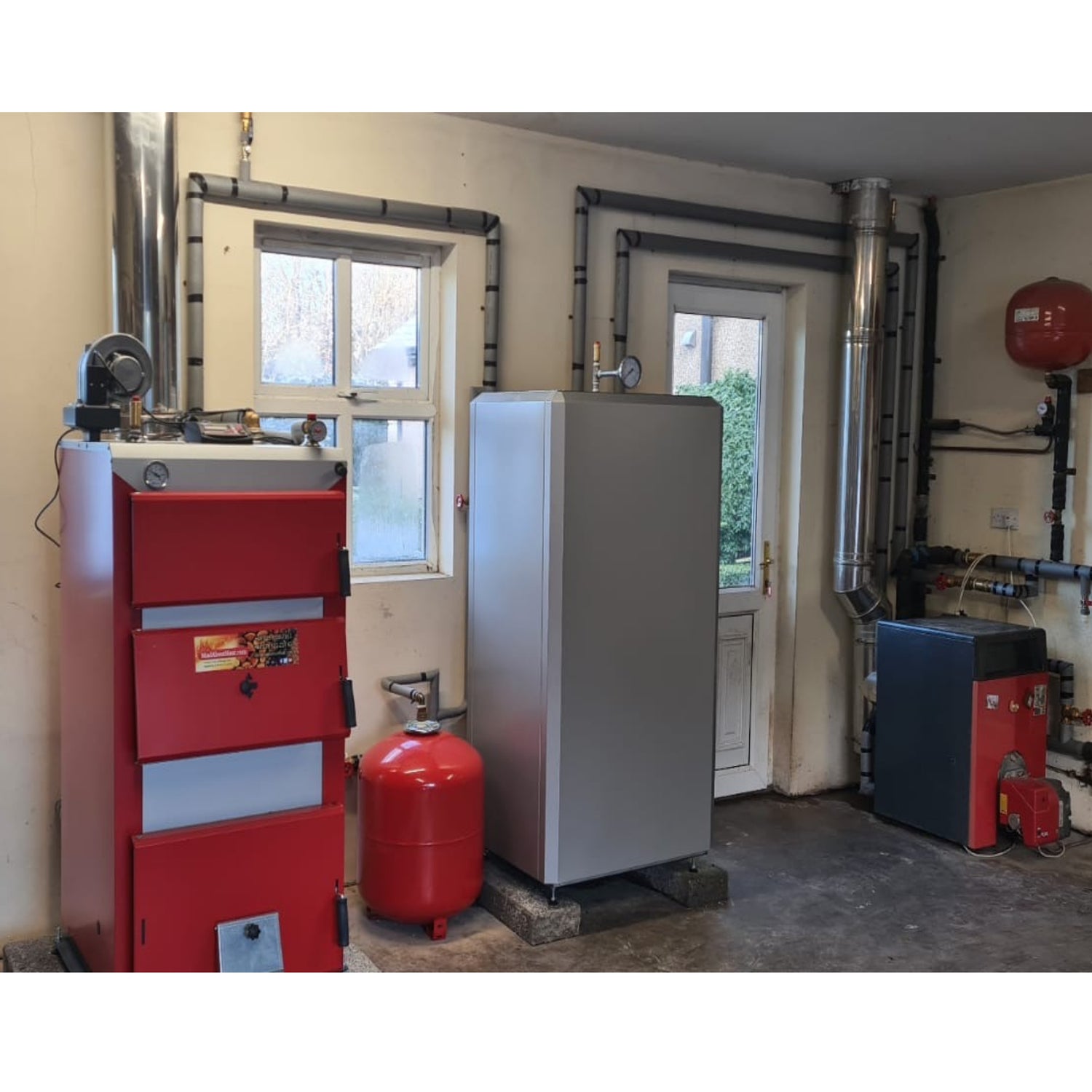solid fuel boiler installed, solid fuel central heating system, biomass central heating, log burner